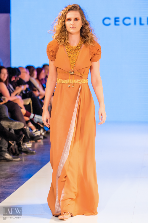 Runway model wearing a couture gown by Cecilia Echenique at Los Angeles Fashion Week